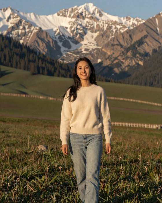 Kyrgyz woman enjoying a mountain meadow in the Tian Shan foothills of Kyrgyzstan